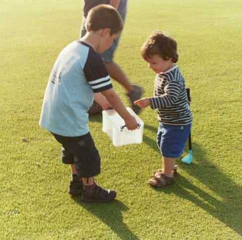 Joseph waves the fines pot at young Josh