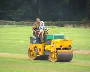Brian gives Jenna a ride on the roller